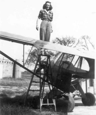 Mary Barnard by Piper Cub
Photo of Mary Barnard standing by the wing of a Piper Cub
Keywords: Mary Barnard standing by the wing of a piper cub Airplane
